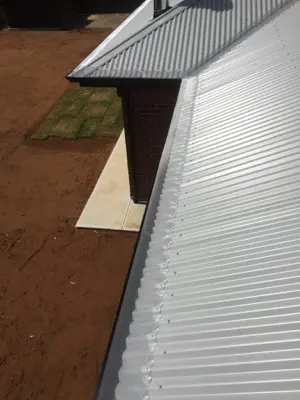Valley guard secured with custom corrugated clips
