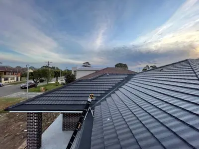 Close-up corrugated roof valley with mesh guard
