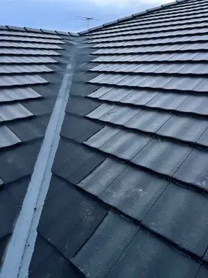 Completed dark tile roof project aerial portfolio shot